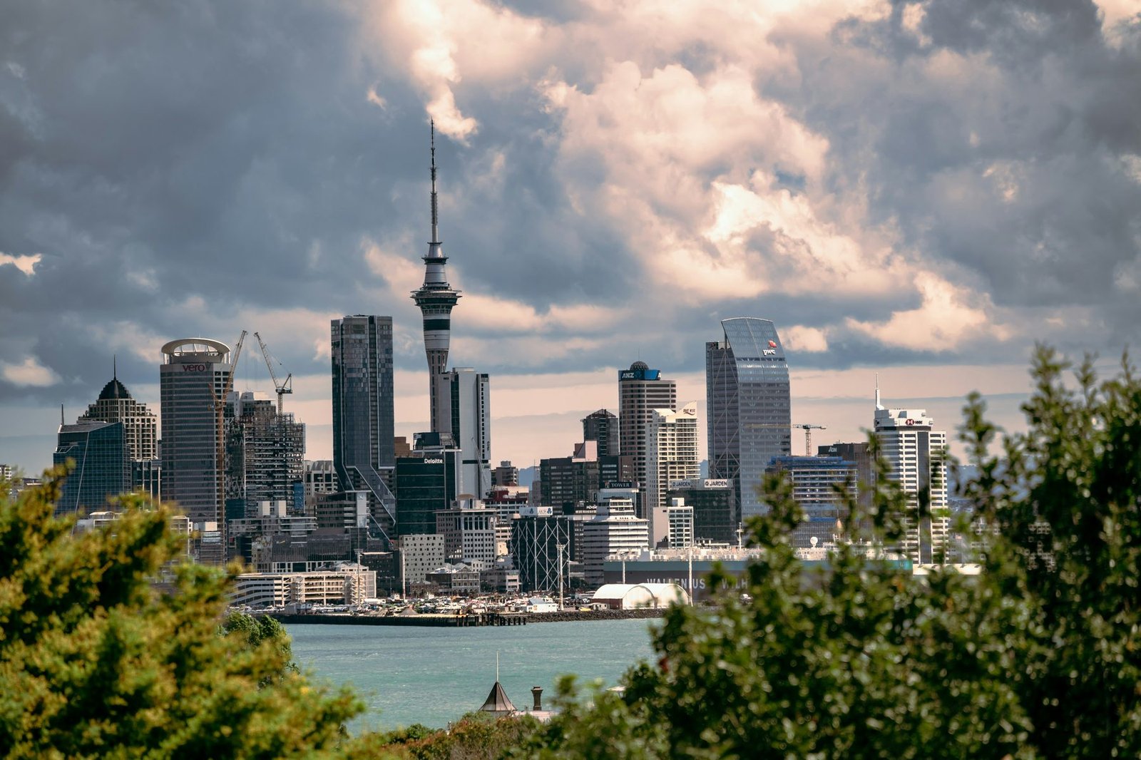 Auckland city skyline viewed across the harbour at dusk